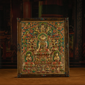 RADIANCE OF COMPASSION – 19TH CENTURY GILT COPPER JOWO BUDDHA WALL THANGKA